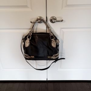 Excellent condition, Geiger Black Leather with Snake skin handles and accents.